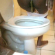 A black girl video-records herself shitting into a toilet in three scenes. Over 6 minutes.